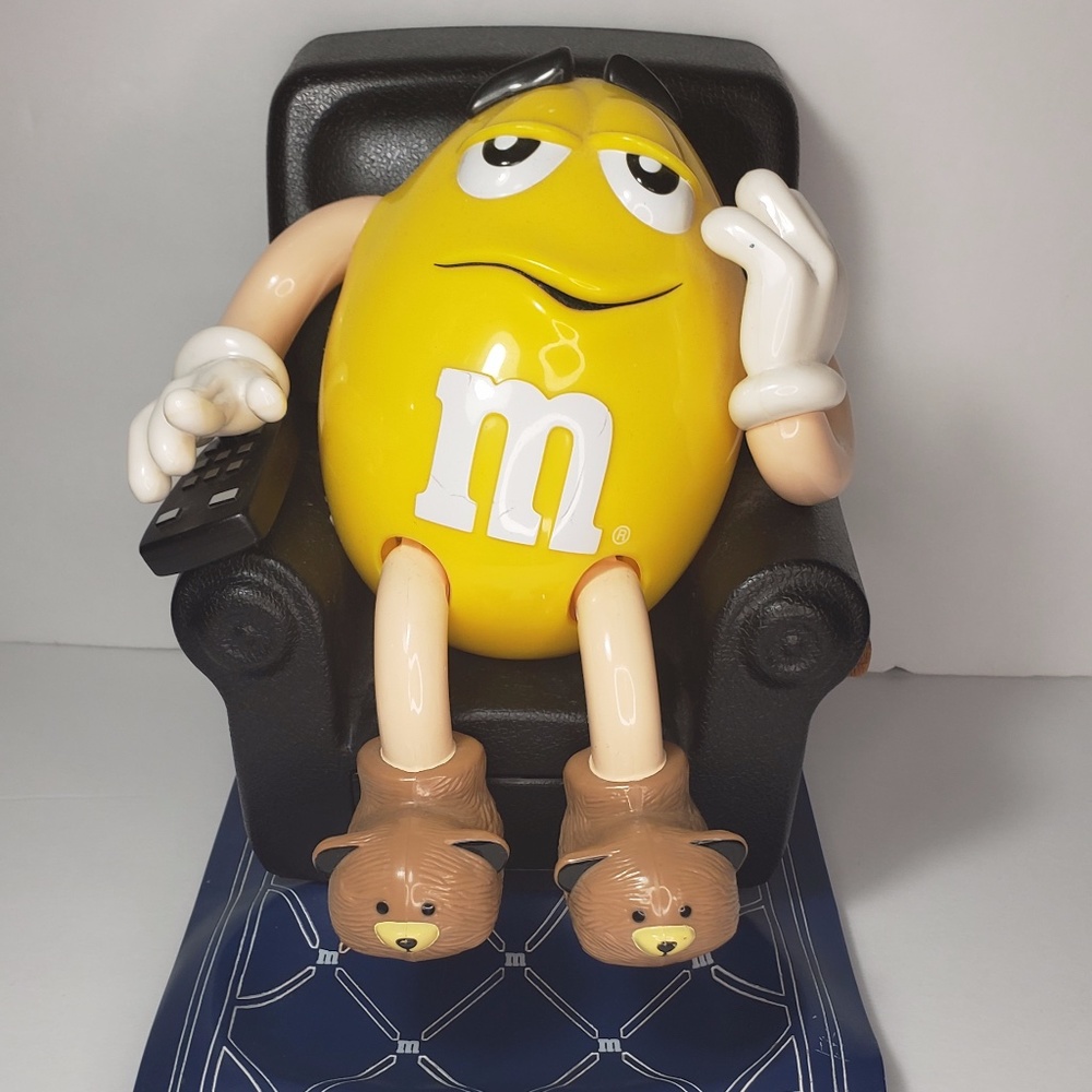 Yellow M&M on Black La-Z-Boy Dispenser